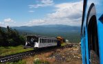 MWCR M7 (orange locomotive) on the way up passes by our train on the way down at Waumbek Water Tank